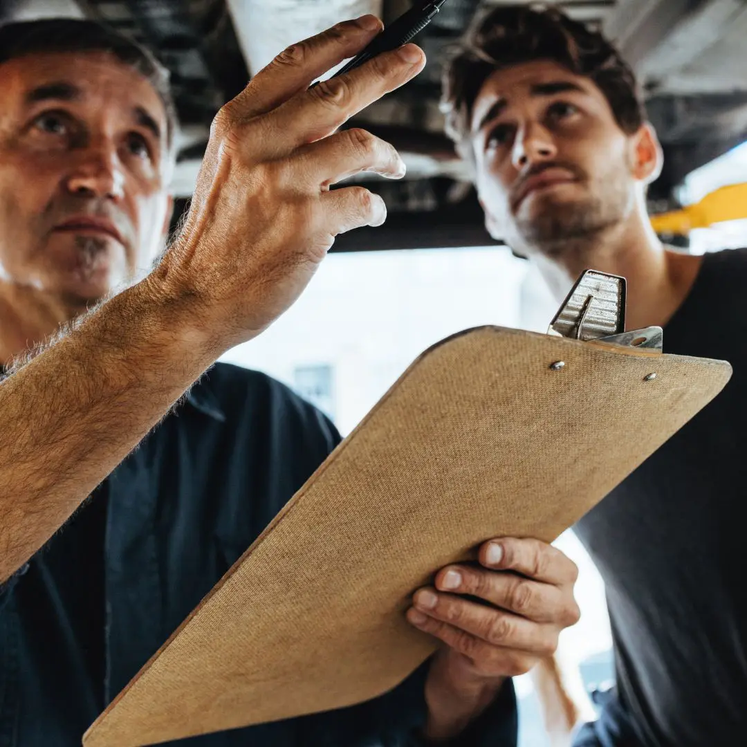 Homeowner receiving professional termite inspection consultation.